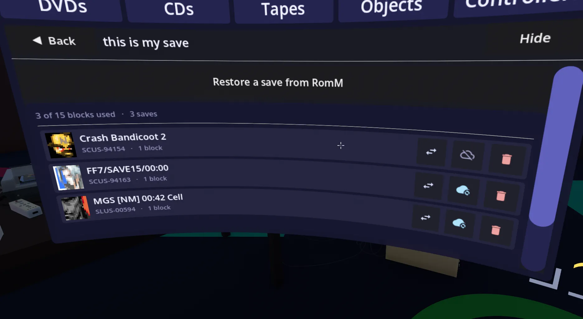 The memory card manager, showing a card named “this is my save” with 3 of 15 blocks used and three saves — Crash Bandicoot 2, FF7 and Metal Gear Solid — each with move, cloud-backup and delete buttons, above a “Restore a save from RomM” option.